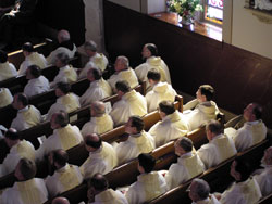 Clergy gather in a church