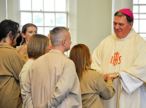 Archbishop Tobin with prisoners