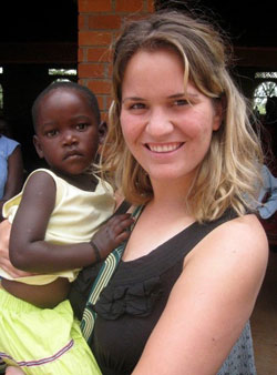 Claire Schaffner, a member of St. Pius X Parish in Indianapolis, holds a child named Angel during her time as a volunteer at a medical clinic in Uganda during the summer of 2010. (Submitted photo)