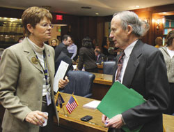 Rep. John Day speaks with Rep. Gail Riecken on the floor of the Indiana House of Representatives. (Submitted photo)