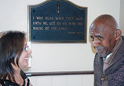 In her work at A Caring Place, Cathy Lamperski Dearing has helped Lucian Jones recall his days as a preacher by sharing the words from Psalm 122:1.  (Photo by John Shaughnessy)