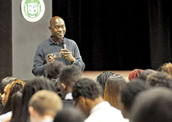 Thomas Awiapo, a native of Ghana who works in that country for Catholic Relief Services (CRS), shares with students of Providence Cristo Rey High School in Indianapolis his story of survival through the CRS Rice Bowl Campaign on March 14. (Photo by Natalie Hoefer)