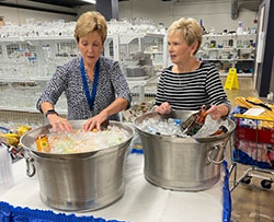 Jenny Matthews, left, and Mary Ann Klein are leading a fundraiser for Cathedral Soup Kitchen in Indianapolis to make desperately-needed improvements at the facility and to honor their late friend, Kenny Schutt, a longtime volunteer there. In this photo, they are volunteering for a sale at Mission 27, a retail store that benefits the efforts of the Society of St. Vincent de Paul. (Submitted photo)