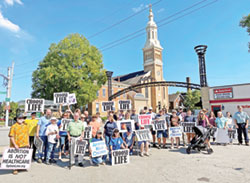 Participants in the LifeChain event in Lawrenceburg pose in front of St. Lawrence Church on Respect Life Sunday, celebrated on Oct. 1 this year. The Catholic Church celebrates October as Respect Life Month, a time to consider more deeply why every human life is valuable and reflect on how to build a culture that protects life from conception to natural death. (Submitted photo)