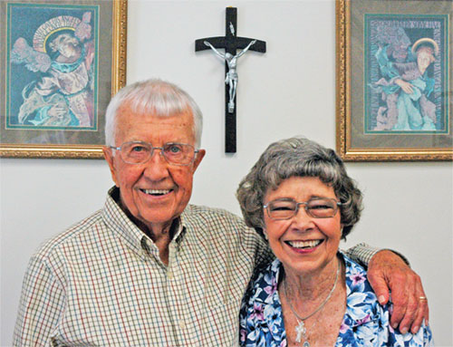 In their 40 years as extraordinary ministers of holy Communion, Tom and Jane Meier have shared the Eucharist with many people, drawing closer to Christ through their efforts. (Photo by John Shaughnessy)